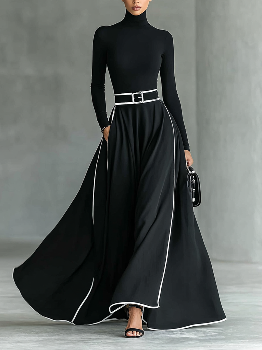 Gina – Vestido Maxi Negro con Costuras Blancas, Cuello Alto y Manga Larga