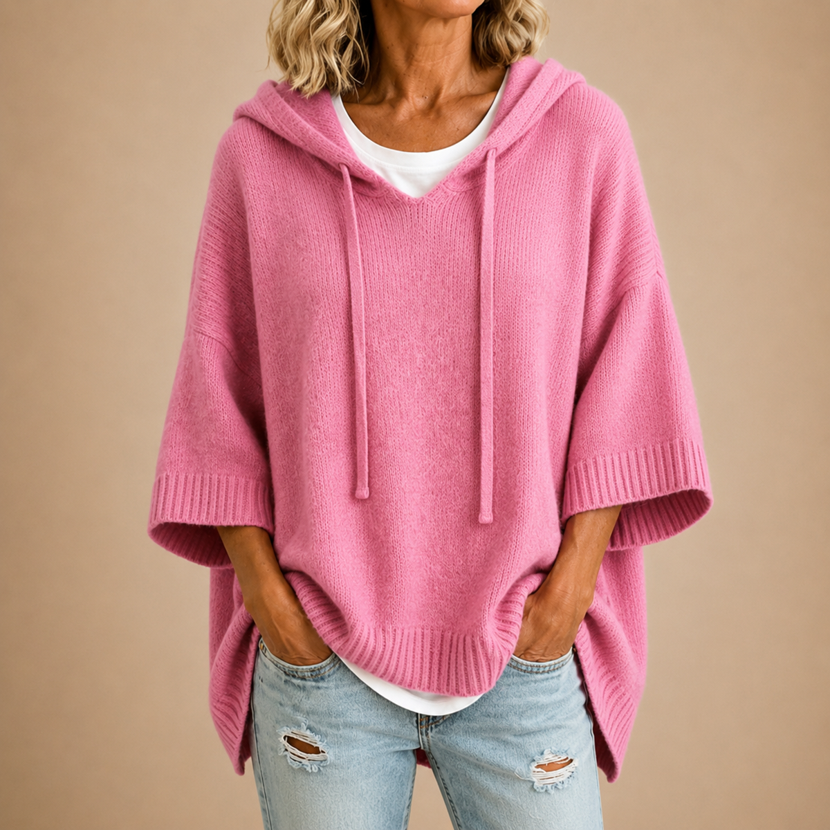 Poncho tejido con capucha rosa