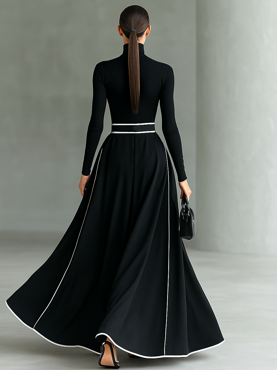 Gina – Vestido Maxi Negro con Costuras Blancas, Cuello Alto y Manga Larga